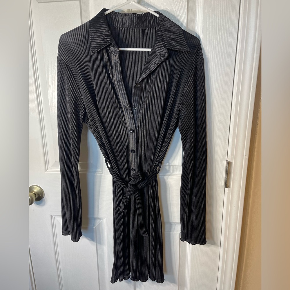 Black knee length dress with matching belt and buttons going down the front